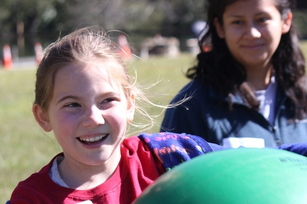 girl playing with ball during Camp Crinkleroot